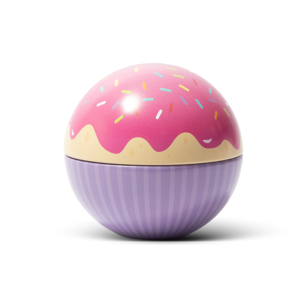 A spherical container tin styled like a cupcake, with a pink frosted top, multi-coloured sprinkle details, and a purple striped wrapper-like base, shown on a clean white background.