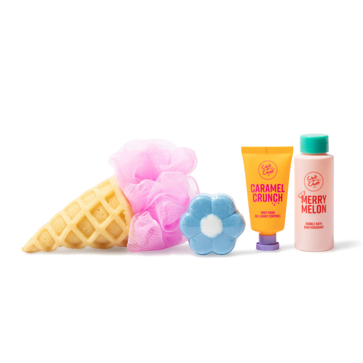 A bath and body gift set featuring a waffle-cone-shaped sponge and pink loofah, a blue flower-shaped fizzer, a yellow tube labelled Caramel Crunch, and a pink bottle labelled Merry Melon, arranged on a white background.