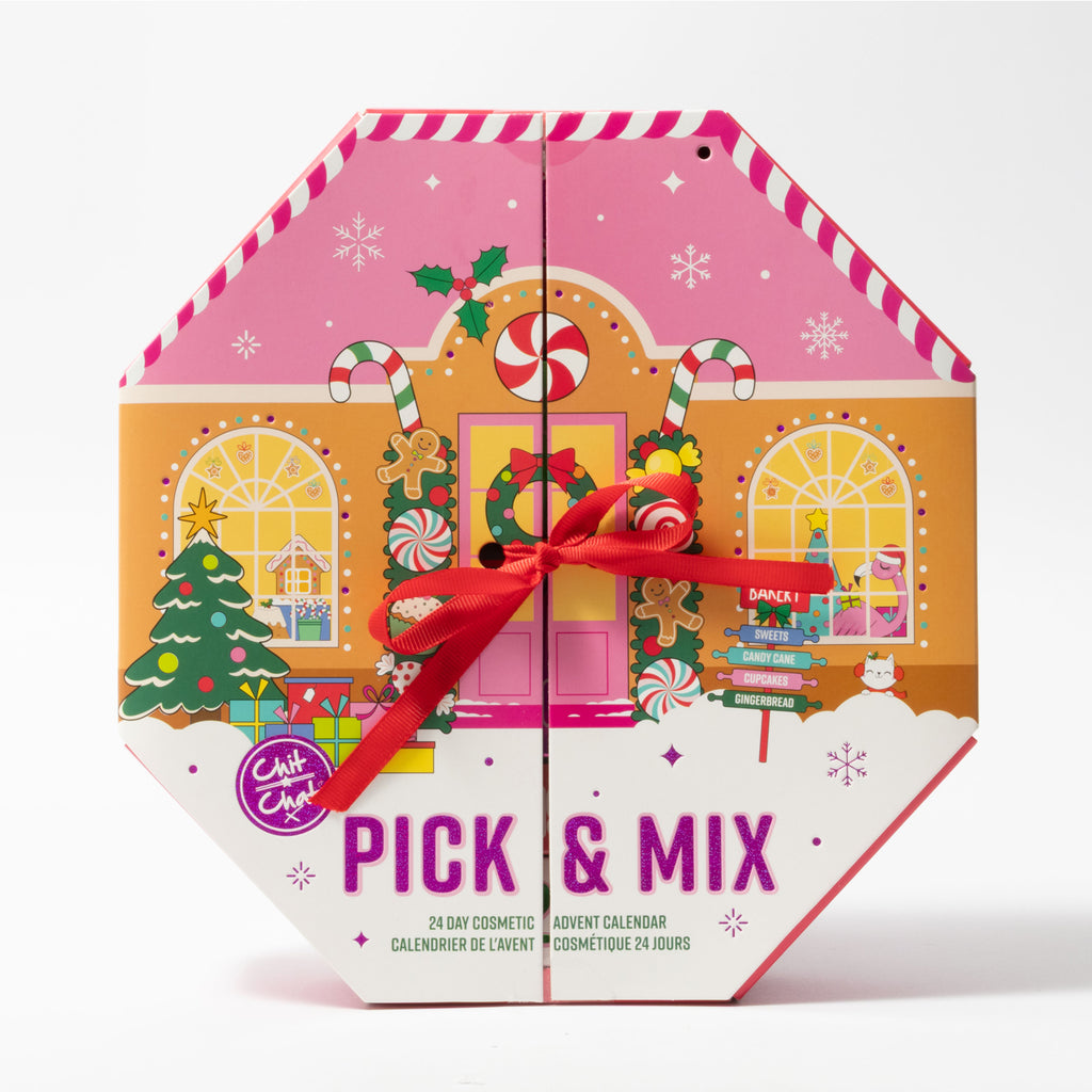 A hexagonal 'Pick & Mix' 24-day cosmetic advent calendar box, designed as a Christmas decorated house with a pink roof, decorated with a red ribbon bow in the centre to tie the doors of the box closed.
